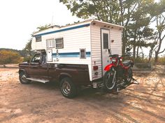 a truck with a camper attached to the back