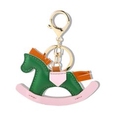 a keychain with a horse on it's back and pink trimmings