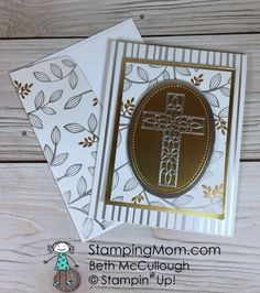 a card with a cross on it and two cards next to it, both have gold foil