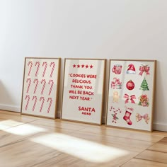 three framed christmas pictures on the wall in an empty room with wooden floors and hard wood flooring