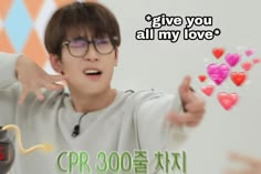 a young man wearing glasses and pointing to hearts on the screen with words above him