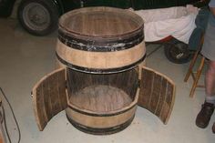 a wooden barrel sitting on top of a floor