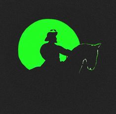 a man riding on the back of a horse in front of a green moon