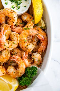 the cover of how to make air fryer shrimp with lemon wedges and parsley