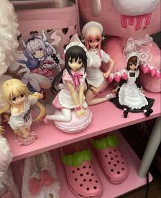 a shelf filled with lots of dolls and stuffed animals on top of it's sides