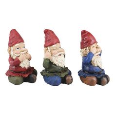 three gnome figurines sitting next to each other