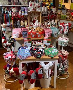 a room filled with lots of different types of items on display in buckets and baskets