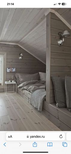 an attic bedroom with wood floors and white walls is featured on the instagram page