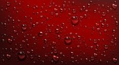 drops of water on a red background