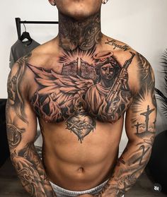 a man with many tattoos on his chest