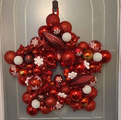 a red and white christmas ornament wreath