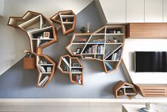 a living room with bookshelves on the wall