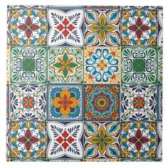 an artistic tile design with many different colors and designs on the tiles, including flowers