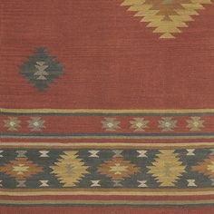 an old rug with different colors and patterns