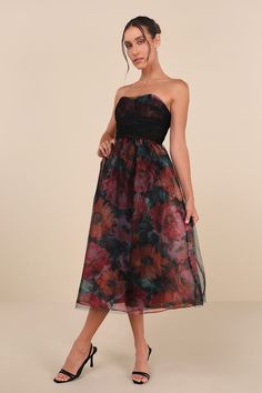 Stunning and sweet, the Lulus Splendidly Yours Black Floral Organza Mesh Strapless Midi Dress is the perfect treat! Shiny floral organza shapes this exceptional dress with a black, sheer mesh overlay that adorns a strapless, ruched bodice with seamed cups and a sweetheart neckline (with hidden no-slip strips). High, fitted waist sits atop a matching skater skirt that falls to a chic midi hem. Hidden back zipper/clasp. Fit: This garment runs small - please size up. Length: Mid-calf length. Size medium measures 38.5" from top to bottom. Bust: Works best for A to C cup sizes - consider sizing up for fuller bust. Waist: Fitted - very fitted at natural waist. Hip: Not Fitted - fuller skirt allows room for hips. Undergarments: May be worn with a strapless bra, adhesive bra, petals, or no bra. Fa Holiday Formal Dresses, Holiday Dresses Women, Eve Dresses, New Years Eve Dresses, Strapless Midi Dress, Wedding Guest Dresses, Autumn Dress, Ruched Bodice, Mesh Overlay