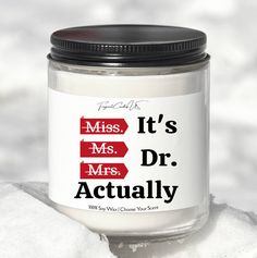 it's mr and mrs actually in a glass jar on snow covered ground with black lid