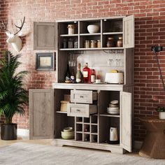 a room with a brick wall and an open cabinet on the floor next to a potted plant