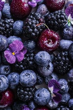 blueberries, raspberries and other berries are mixed together