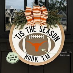 a football themed door hanger that says tis the season hook'em