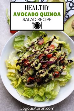 healthy avocado quinoa salad recipe on a white plate with lettuce and tomatoes