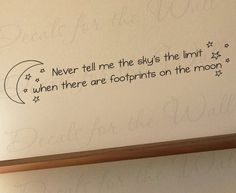 a wall with writing on it that says never tell me the sky's the limit when there are footprints on the moon