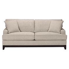 a beige couch with pillows on it