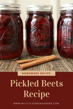 three jars filled with pickled beets and cinnamon sticks on top of a table