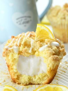 there is a muffin with lemons and marshmallows on the side