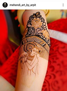 a woman's arm with an intricate tattoo on it