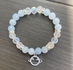 my sis bracelet Pretty Bracelets Bead, Cool Bracelet Ideas, Crystal Bracelet Ideas, Bracelet Ideas Beads, Bracelets Business, Saturn Charm, Aesthetic Bracelet, Crystal Bead Jewelry