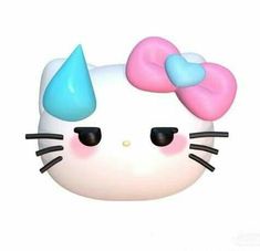 a close up of a hello kitty mask with blue and pink bows on it's head