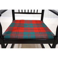 a black chair with a red and blue plaid seat pad