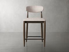 an upholstered chair with a wooden frame and backrest, against a gray background