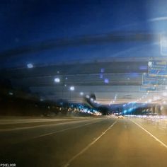 blurry photograph of an empty highway at night