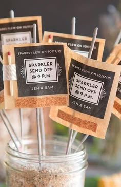 there are some small crackers on sticks in a jar with labels that read sparkler send off 6 pm