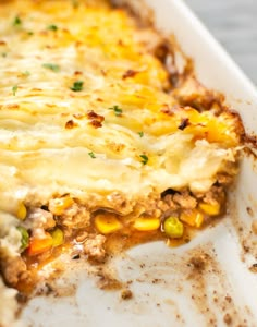 a casserole dish with meat, corn and cheese