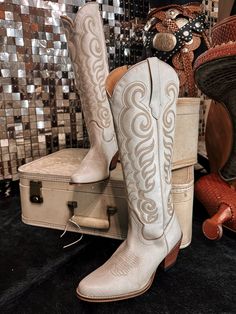 Embrace effortless Western elegance with these breathtaking boots. Crafted from buttery-soft suede in a dreamy, cloud taupe hue, they feature exquisite Western embroidery that adds a touch of authentic charm to the smooth, supple surface. The classic cowboy boot silhouette, with its pointed toe and stacked heel, provides both style and comfort. Perfect for dressing up or down, these versatile boots will become a go-to in your footwear collection. Express your awesome Western-inspired fashionista White Boots For Western-themed Events, Cream Boots For Western-themed Spring Events, Cream Boots For Spring Western-themed Events, Elegant Snip Toe Boots For Western-themed Events, Chic Leather Boots For Western-themed Events, Western Cream Boots With Reinforced Heel, Western Cream Boots For Ranch, Cream Western Boots With Reinforced Heel, Western Style Cream Boots With Reinforced Heel