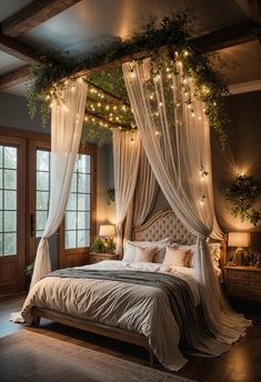 a bed with white drapes and lights hanging from it's headboard in a bedroom