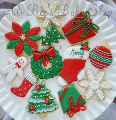 decorated christmas cookies on a white plate