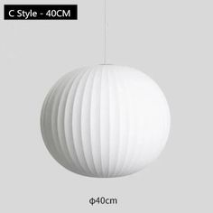 an image of a white ball hanging from a ceiling light with the text c style - 40cm above it