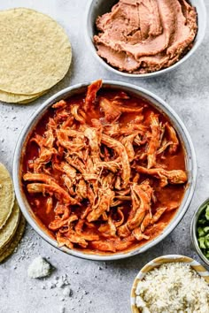 an overhead shot of mexican food with tortillas and salsa