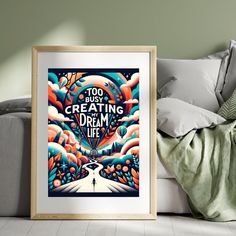 a framed poster sitting on top of a white couch