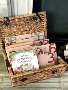 a wicker basket filled with christmas books