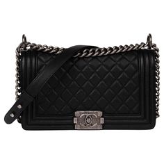 "Chanel Black Quilted Caviar Leather Medium Le Boy Product Details Xupes Ref: CB1293 Brand: Chanel Model: Medium Le Boy Type: Shoulder, Crossbody Serial Number: 23136951 Age: 2017 RRP: £5,800 Accompanied By: Chanel Dust Bag, Box, Authenticity Card, Care Booklet, Ribbon, Protective Felt, Invoice Colour: Black Hardware: Antiqued Silver Material(s): Caviar Leather Specification Height: 16cm Width: 25.5cm Depth: 9cm Strap Drop: Single: 54cm Double: 30cm Interior: Black Textile Closure: S Lock Country of Origin: France Authenticity Details: Authenticity Card, Serial Sticker Condition Condition Rating: Excellent Exterior Condition: The exterior is in excellent condition with minimal signs of use. Interior Condition: The interior is in excellent condition with minimal signs of use. Hardware Condi Chanel Boy Bag Black, Chanel Crossbody, Oversized Bag, Gold Chanel, Chanel Shoulder Bag, Small Boy, Chanel Model, Stylish Shoulder Bag, Heart Bag