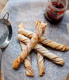 some bread sticks are on a cutting board