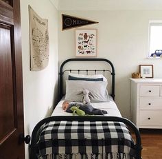 a bedroom with a black and white checkered bedspread