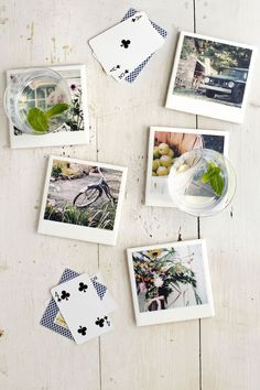 several pictures are arranged on a white table