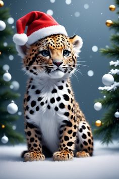 a cheetah wearing a santa hat sitting in front of a christmas tree with snow falling around it