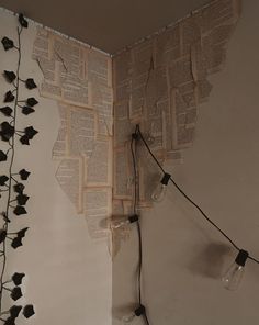 the wall is decorated with books and string lights