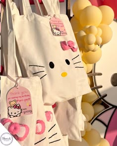 hello kitty bags are hanging on the wall